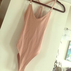 Nude, criss cross back detail bodysuit!